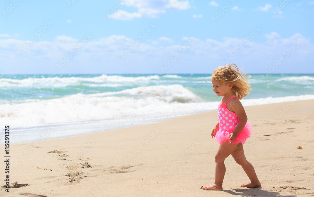 little girl walk on sand beach little girl walk on sand beach