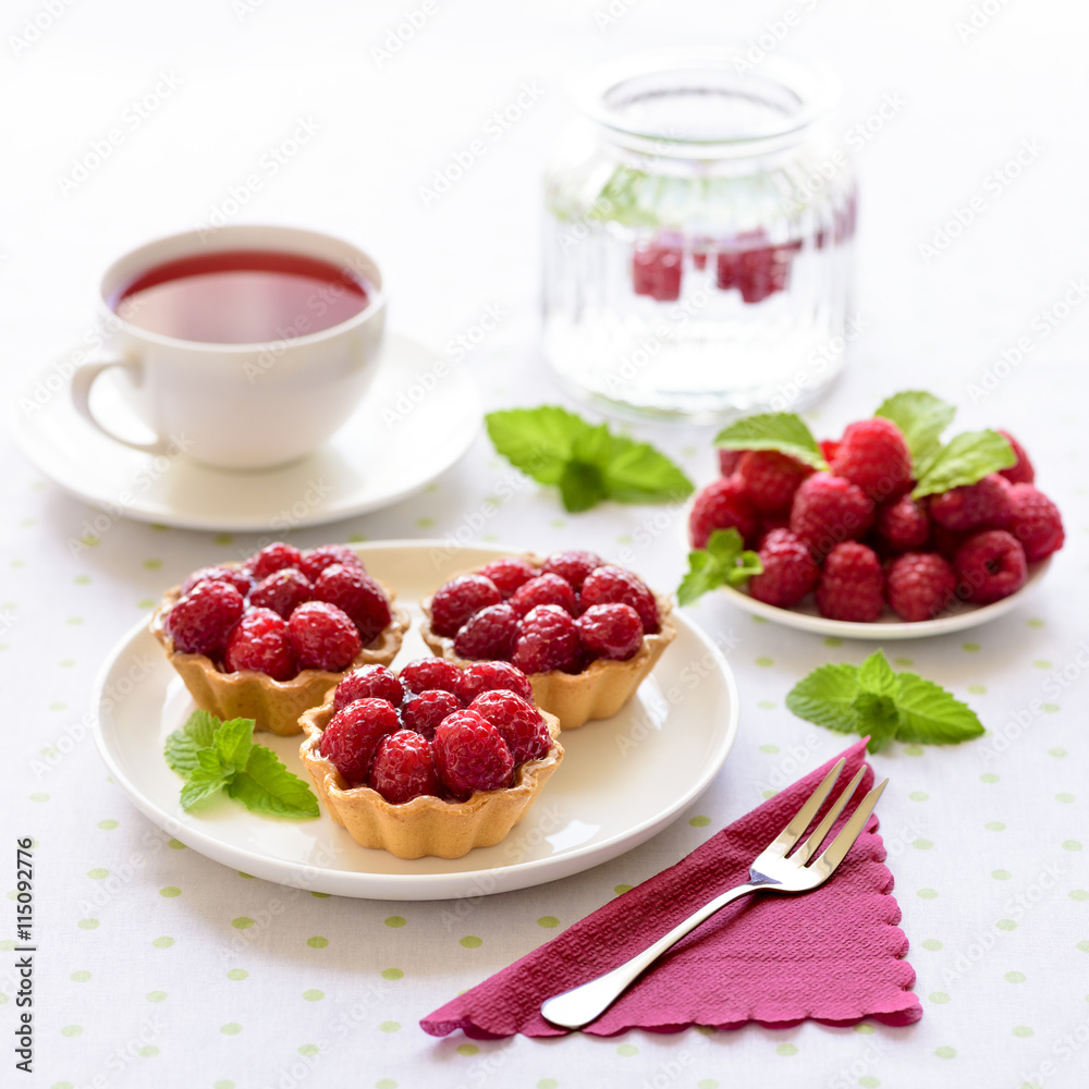 Fruit raspberries tarts or cupcakes on a table Fruit raspberries tarts or cupcakes on a table