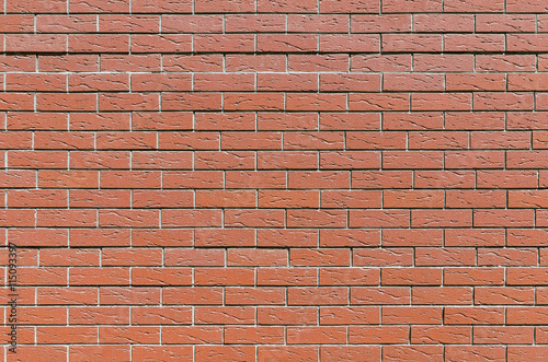 Wall from an equal red brick, background, texture series