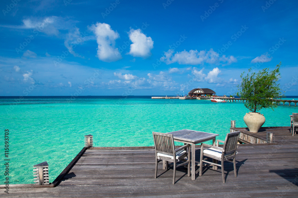 beach with water bungalows at Maldives