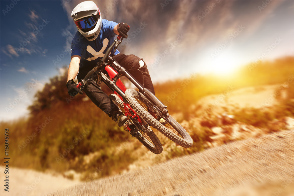 Naklejka premium Professional athlete high jump on a mountain bike.