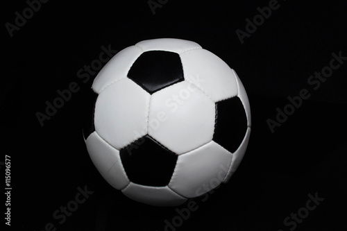 soccer ball on a black background © StockBox