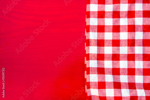 Red napkin at red wooden table