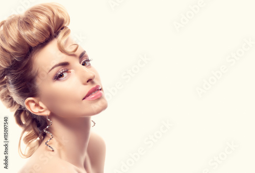 Fashion natural Makeup. Beauty woman with mohawk hairstyle. Blonde nude sexy Model girl, shiny hair makeup, Fashion eyelashes, perfect skin. Creative unusual fashion hairstyle.Skincare concept, model photo