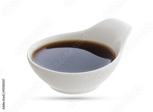 Dish of soy sauce isolated on white