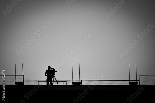 camera operator on the stadium roof
