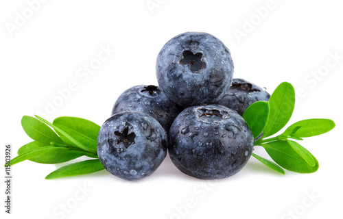Organic blueberries with leaf isolated on white.