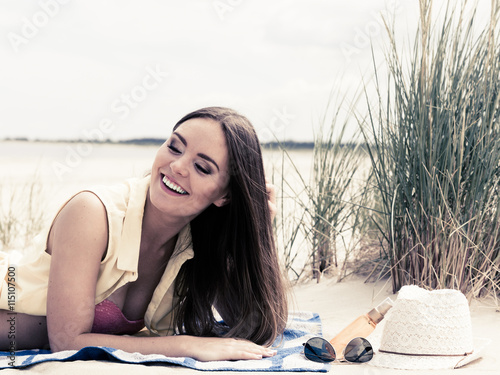 Woman resting on beach.