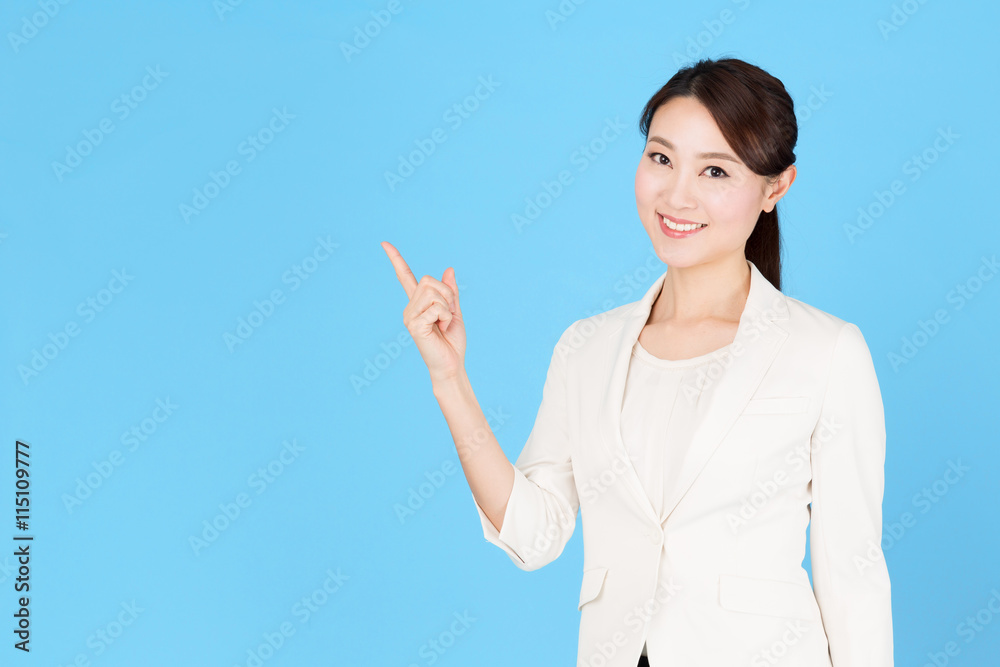 portrait of asian business woman isolated on blue background portrait of asian business woman isolated on blue background