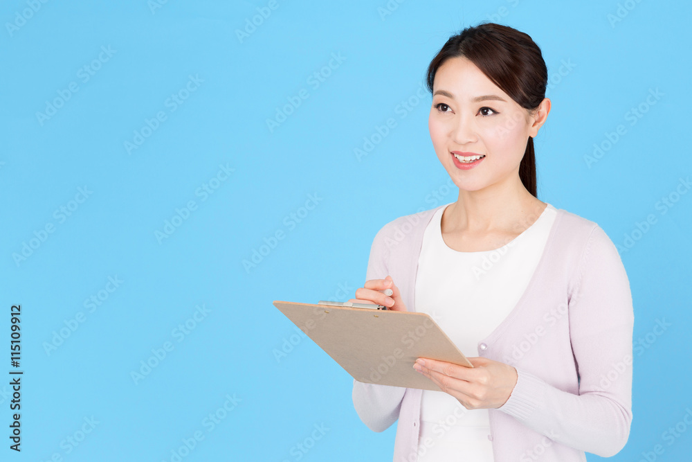 portrait of asian nurse isolated on blue background portrait of asian nurse isolated on blue background