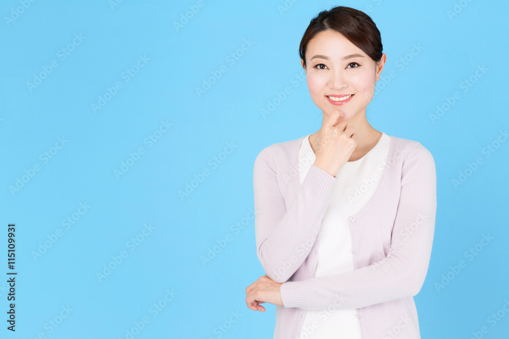 portrait of asian nurse isolated on blue background portrait of asian nurse isolated on blue background
