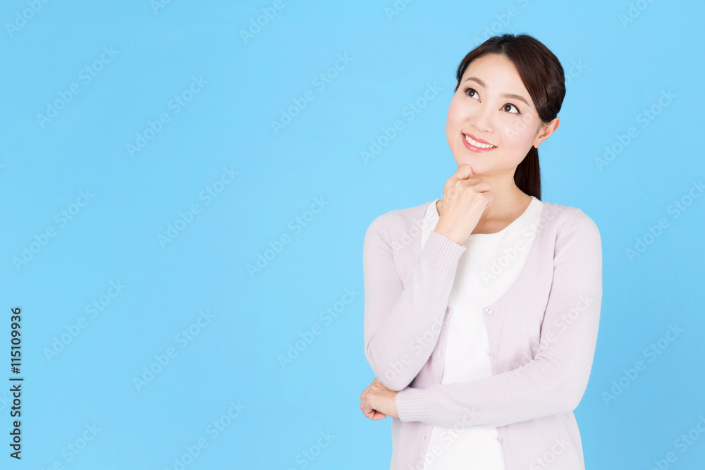 portrait of asian nurse isolated on blue background portrait of asian nurse isolated on blue background