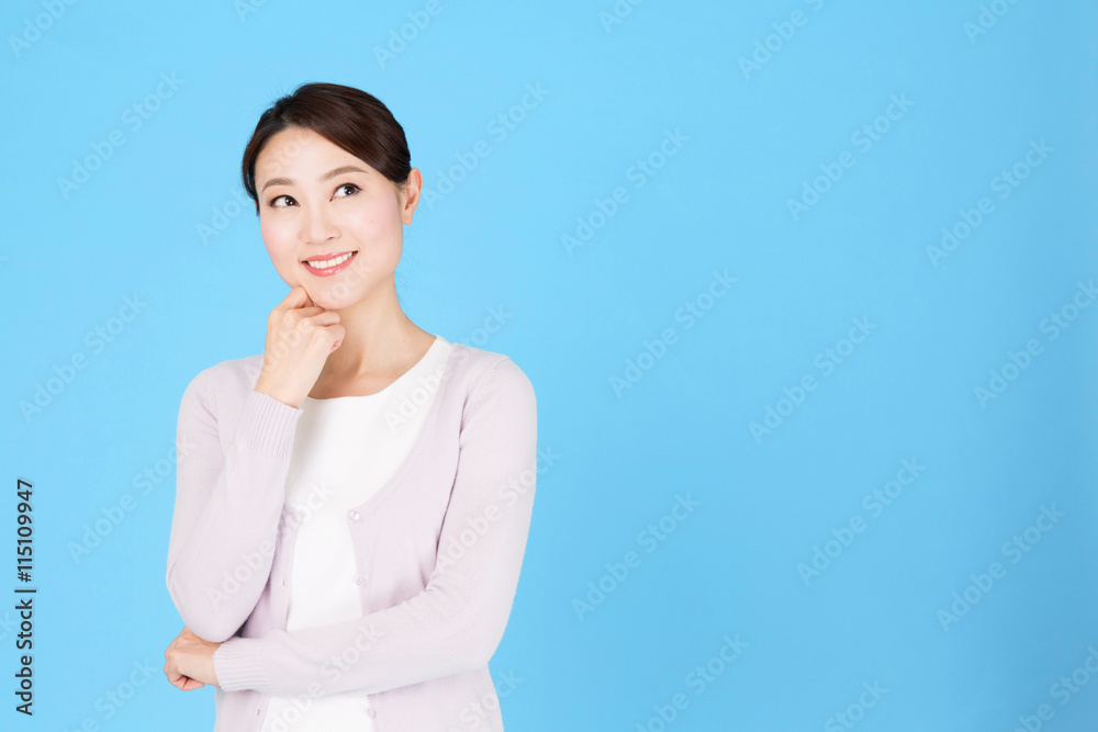portrait of asian nurse isolated on blue background portrait of asian nurse isolated on blue background