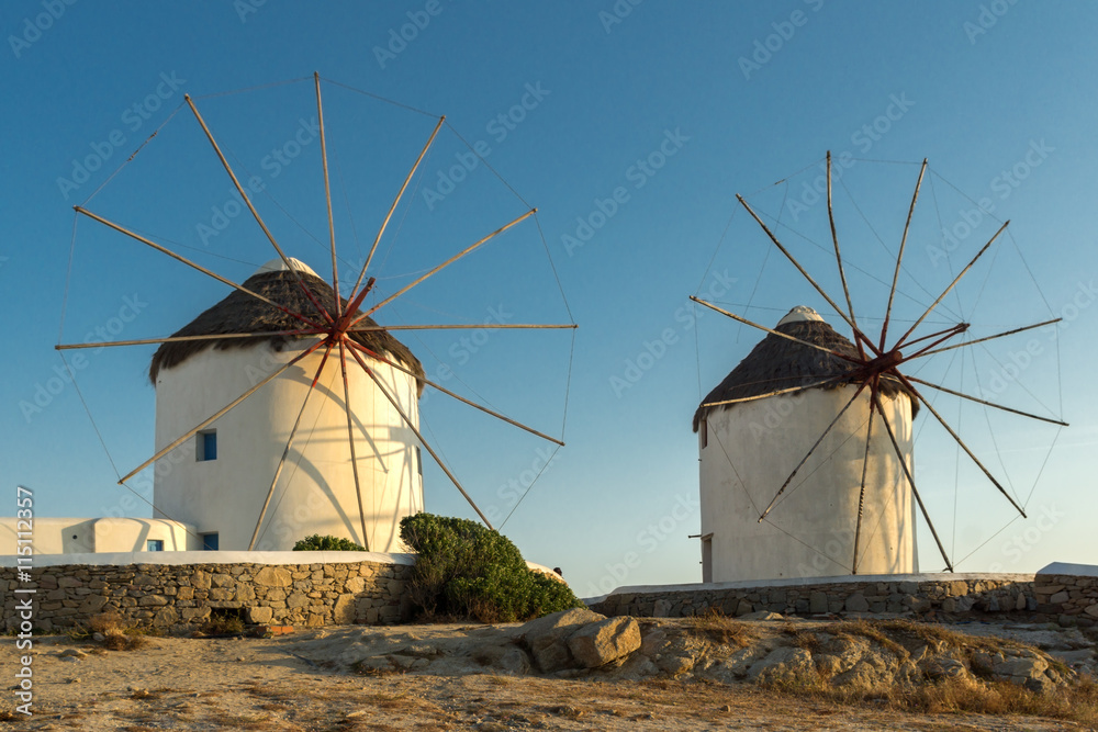 Sunset view of White windmills on the island of Mykonos, Cyclades, Greece - obrazy, fototapety, plakaty 