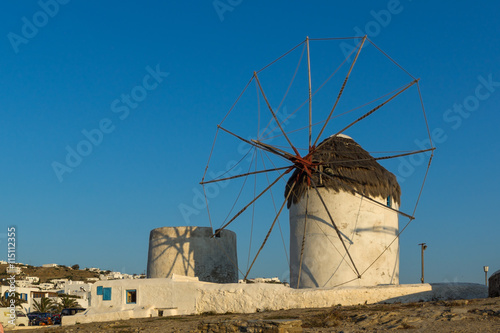Amazing Sunset and White windmills on the island of Mykonos, Cyclades, Greece