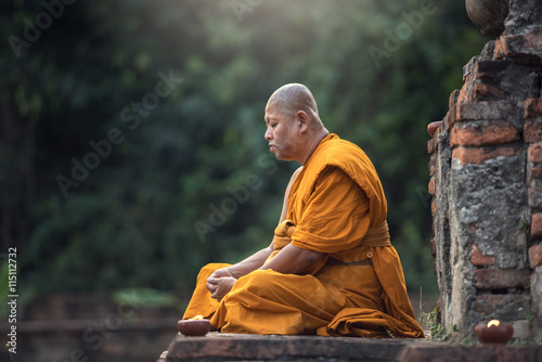 Buddhist monk meditation in temple