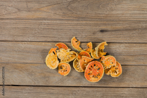 water quince with quince on wooden table