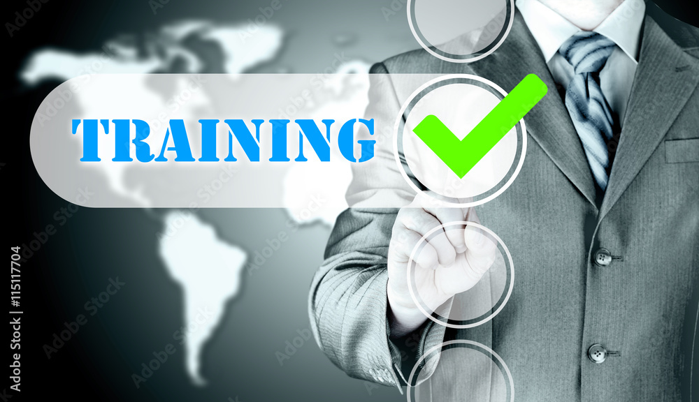 Businessman pressing touch screen interface training checkbox Businessman pressing touch screen interface training checkbox