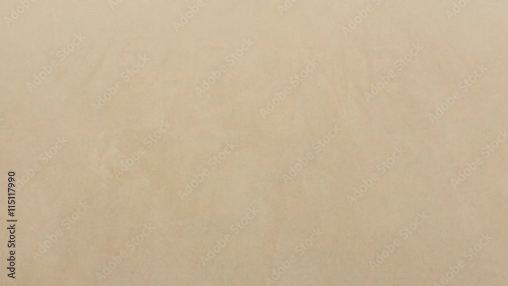 Wave recedes in reverse to reveal Welcome to Rio (as in, de Janeiro, Brazil) message handwritten in smooth sand on the beach in Ipanema Wave recedes in reverse to reveal Welcome to Rio (as in, de Janeiro, Brazil) message handwritten in smooth sand on the beach in Ipanema