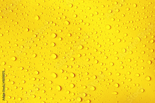 water drop on fresh yellow background