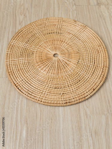 weave tray on warm wood background