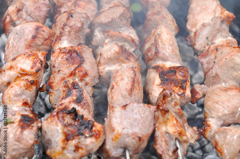 Barbecue Beef Kebabs On The Hot Grill in Smoke Close-up