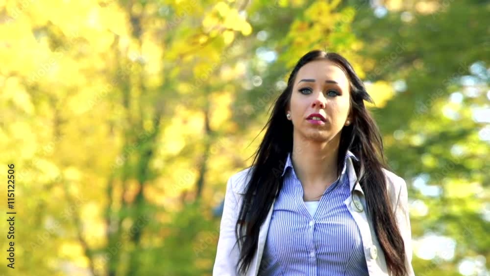 Slowmotion detail of young beautiful calm woman who goes and looks around Slowmotion detail of young beautiful calm woman who goes and looks around