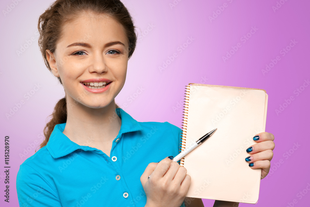 Pretty young beautiful woman standing, writing, take notes Pretty young beautiful woman standing, writing, take notes