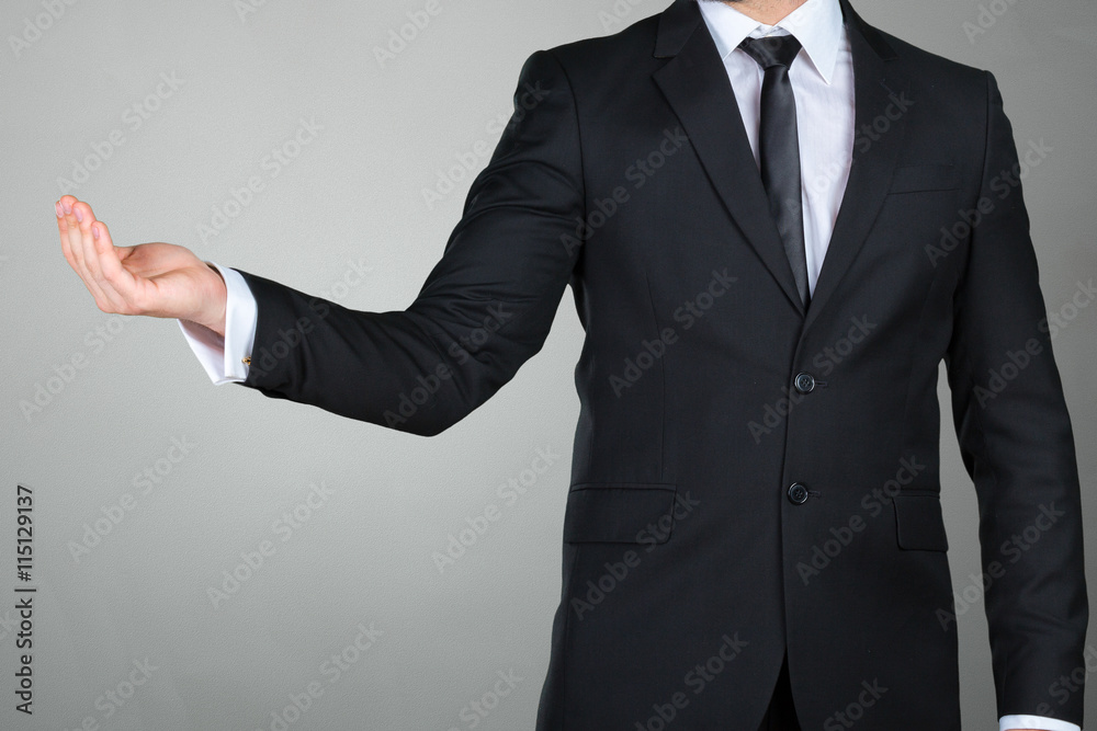Unrecognizable businessman presenting copy space Unrecognizable businessman presenting copy space
