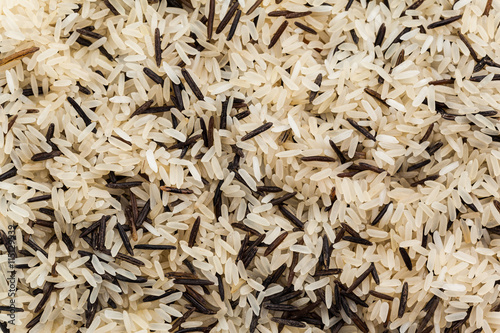 long rice background, uncooked raw cereals, macro closeup