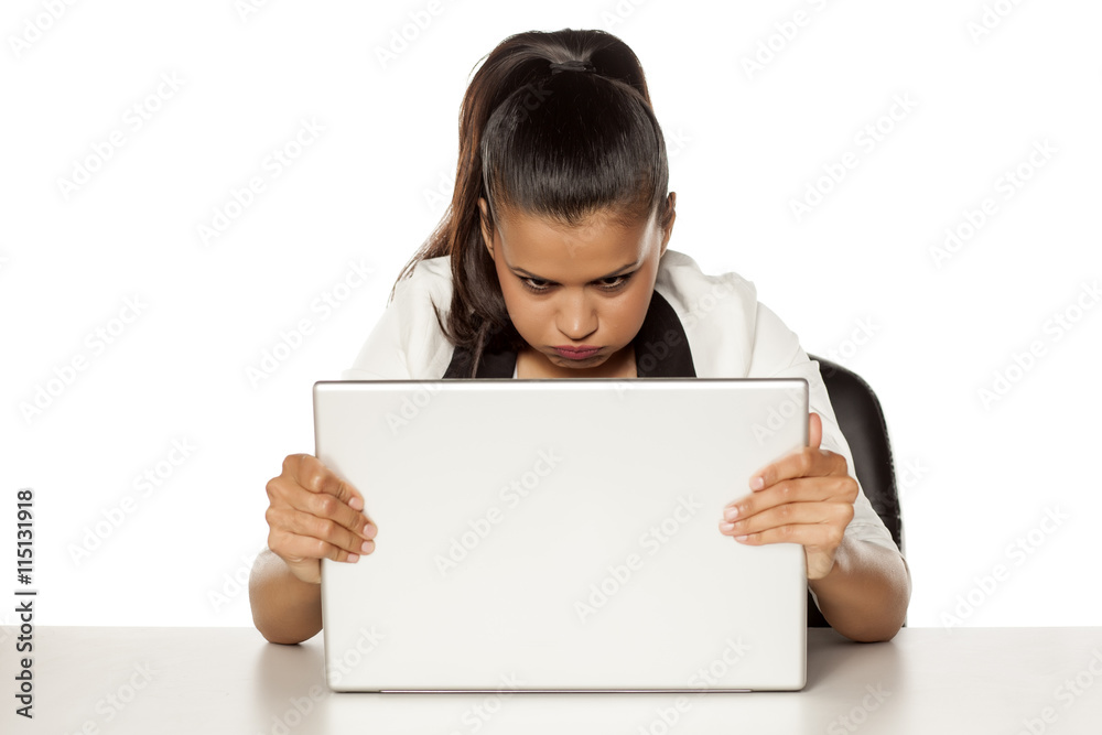 nervous young woman behind the a laptop has a problem nervous young woman behind the a laptop has a problem