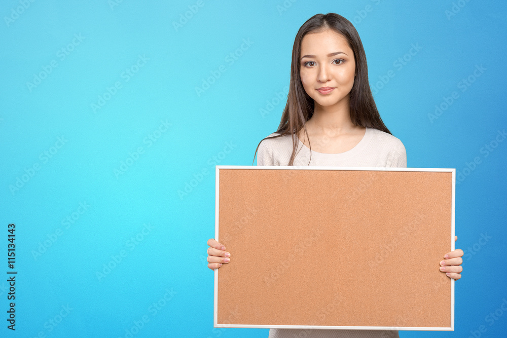 Young dark hair woman keeping cork board Young dark hair woman keeping cork board