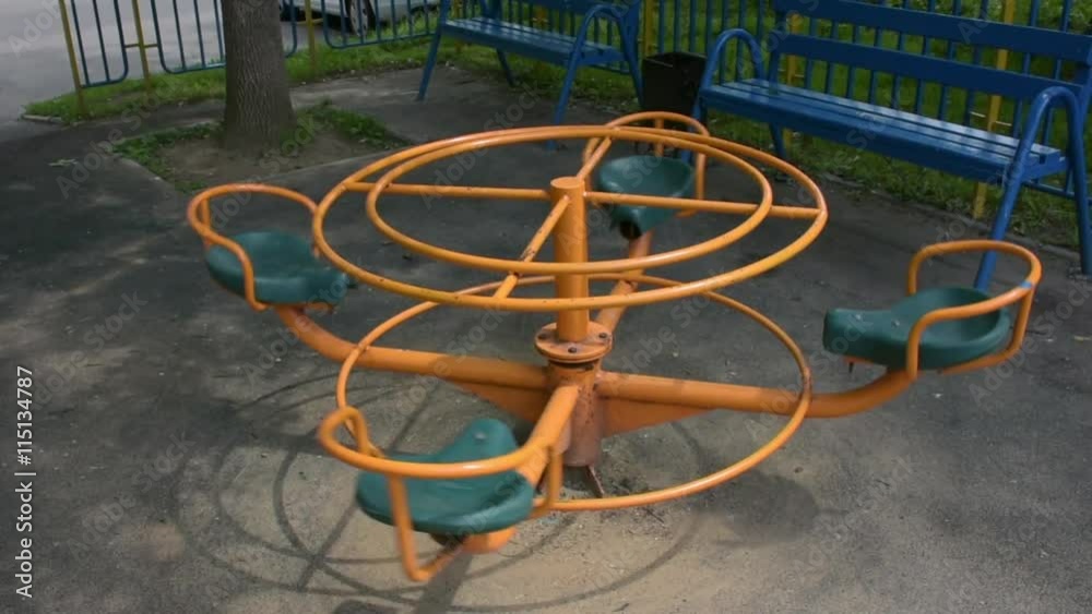 One little children's carousel in the city park. One little children's carousel in the city park.