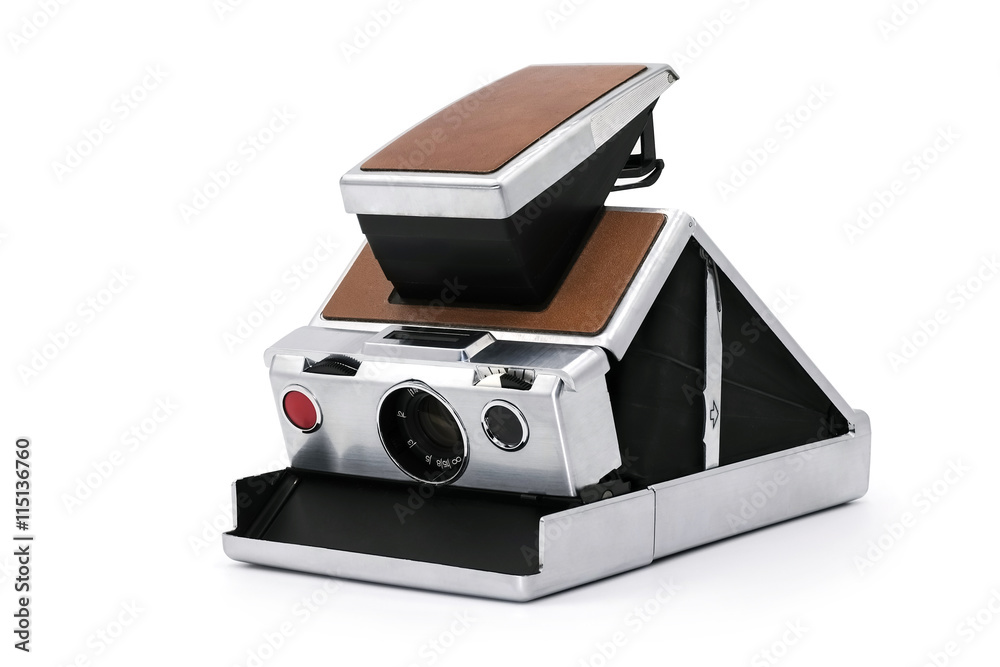 old instant camera on white background, being opened old instant camera on white background, being opened