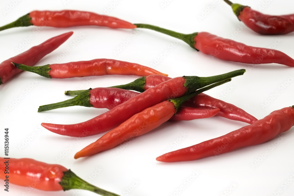 Handful of red hot Thai chili papers on white background