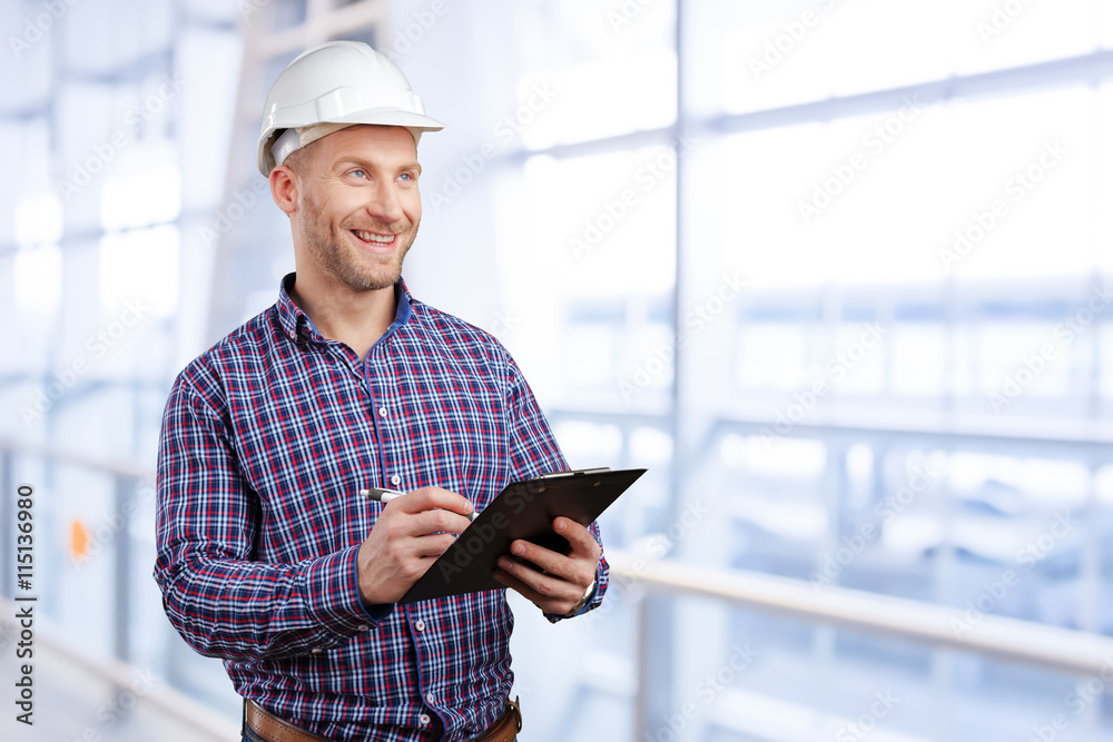 Happy young businessman architect smiling Happy young businessman architect smiling
