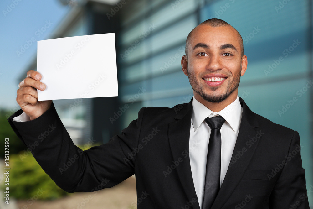 Portrait of a businessman showing a blank business card Portrait of a businessman showing a blank business card