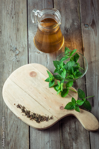 Green tea and mint on cutting board