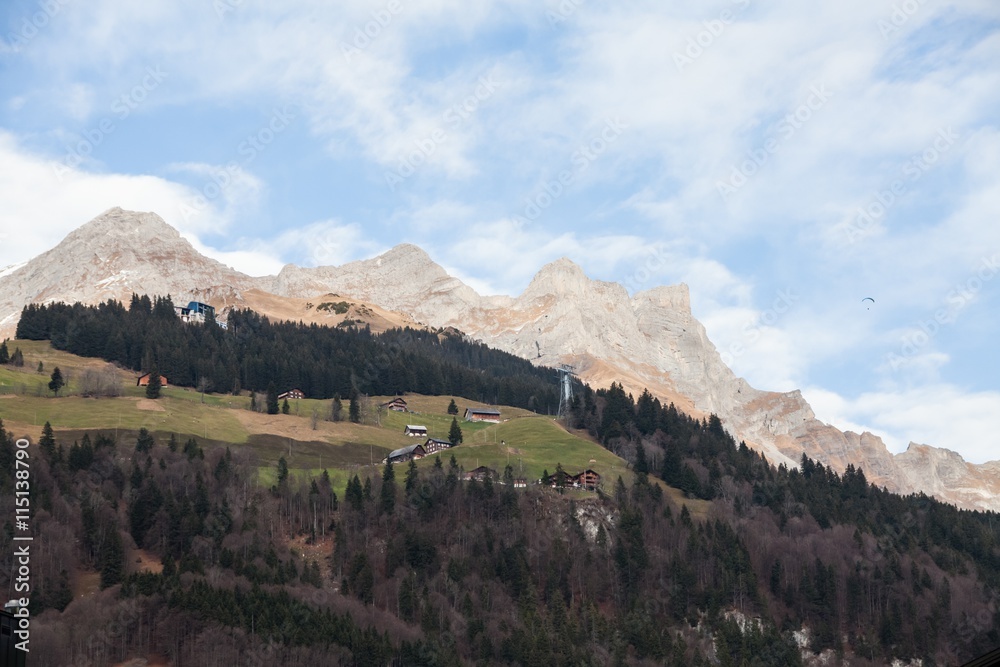 Obraz premium Holiday in Switzerland - Beautiful foggy view of winter landscape towards Engelberg, Switzerland