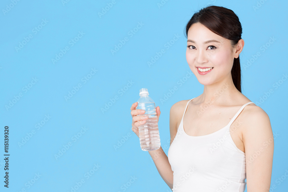 attractive asian woman isolated on blue background attractive asian woman isolated on blue background