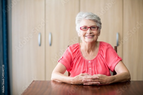 Senior woman sitting at a table
