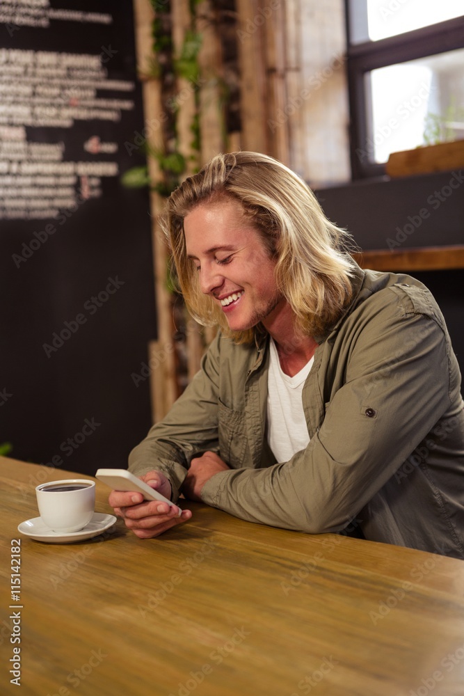 Happy man using a smartphone Happy man using a smartphone