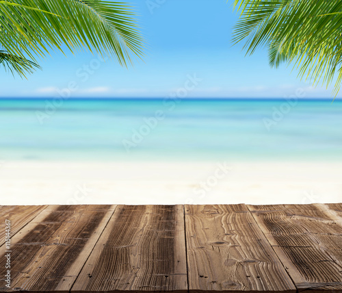 Empty wooden planks with blur beach on background