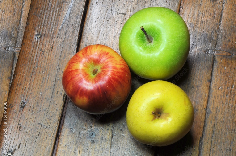 Three apples on wooden background Three apples on wooden background