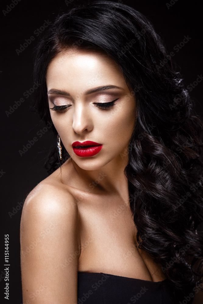 Beautiful woman portrait isolated on black background. Young lady posing with elegant hairstyle, gorgeous make up and red lips. Beautiful woman portrait isolated on black background. Young lady posing with elegant hairstyle, gorgeous make up and red lips.