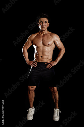 40s hispanic sport man and bodybuilder in gym corporate pose with naked torso muscular body