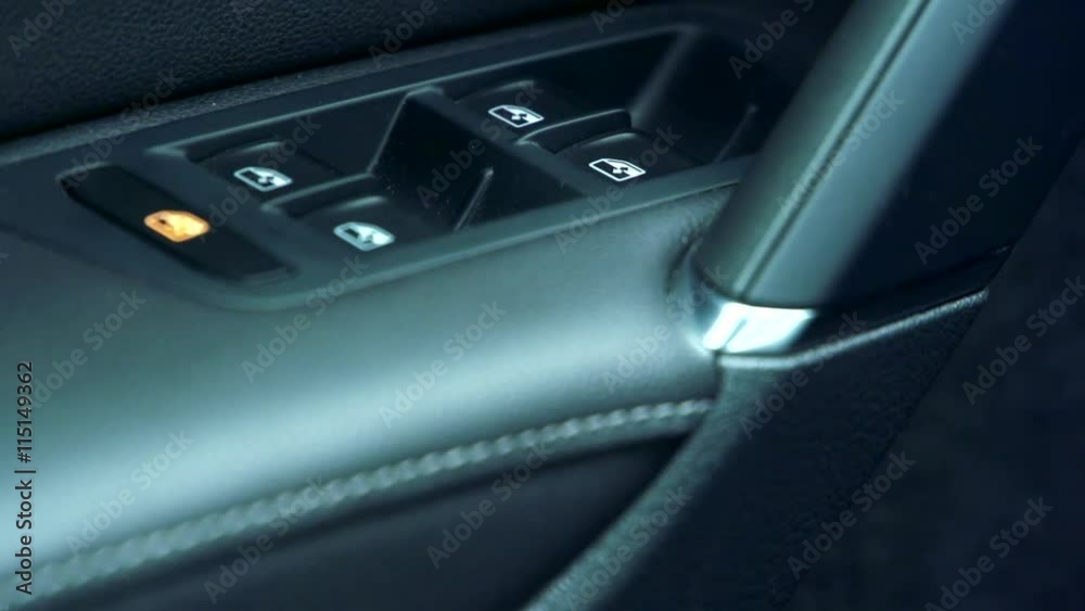 Slowmotion view on door of car with functions for windows