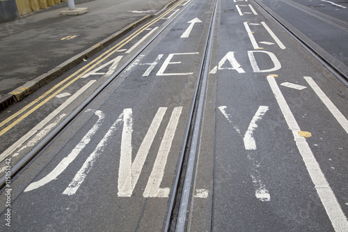 Tram Tracks and Arrow Sign on Street in Nottingham  England