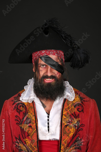 Portrait of handsome man in a pirate costume