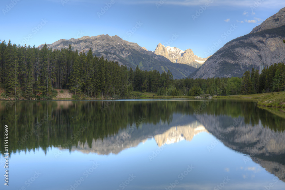 Mountains and Trees Reflecting in a Lake - Banff, Canada Mountains and Trees Reflecting in a Lake - Banff, Canada